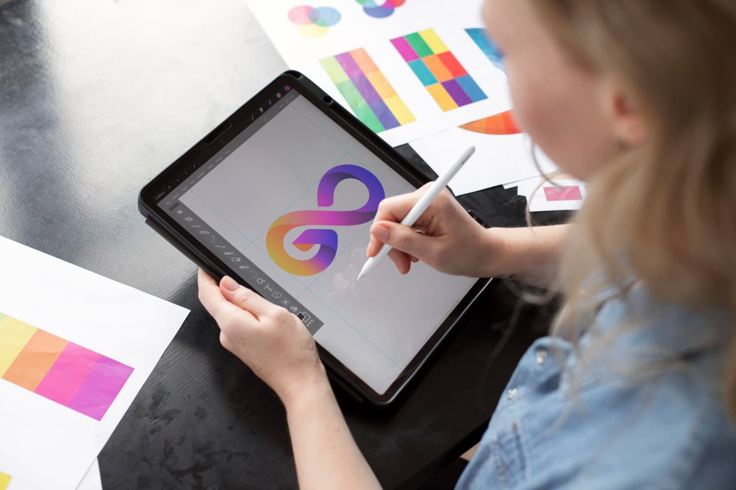 Brand mark being drawn on a tablet