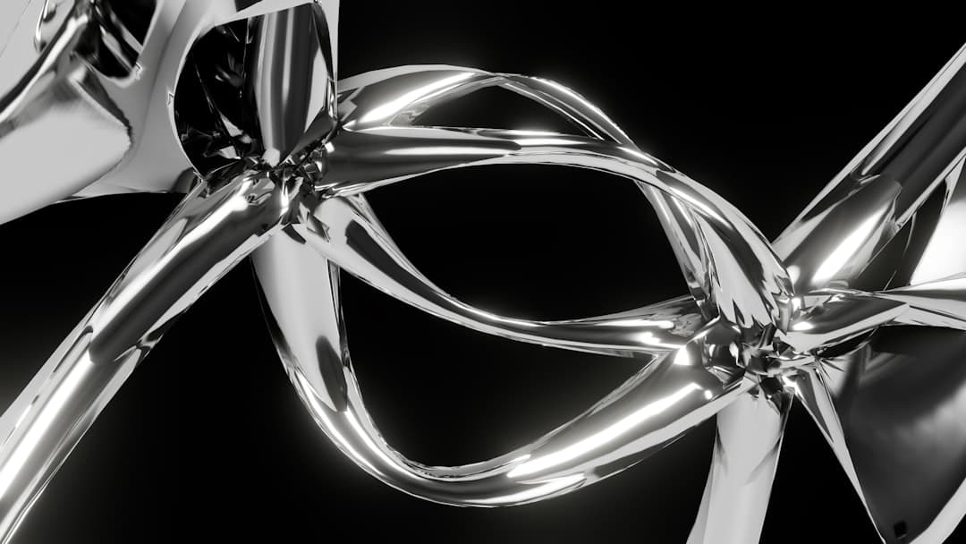Abstract chrome shapes on a dark background